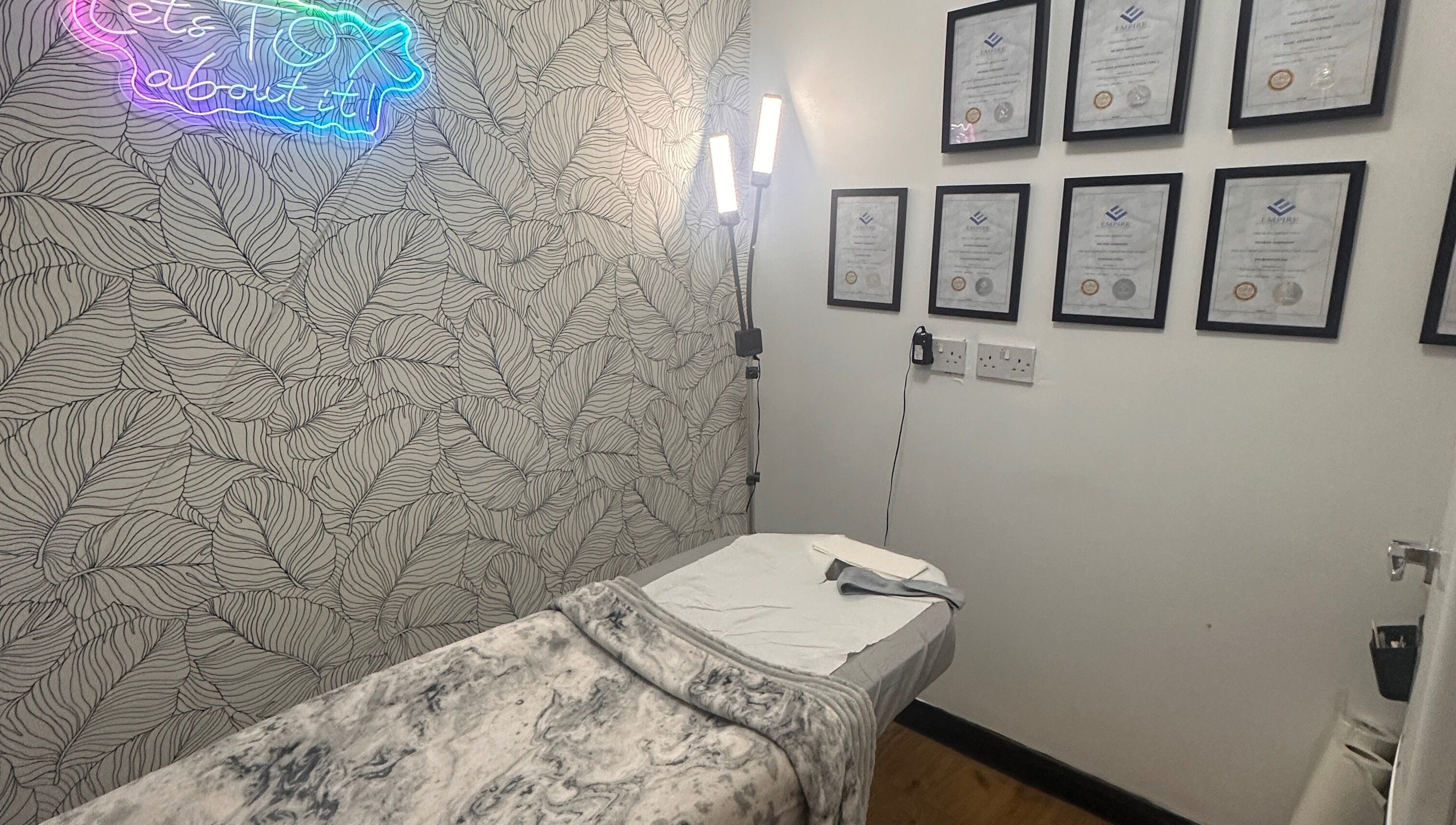 Therapy room at Beauty by Lynz in Kilsyth, Scotland, GB featuring a treatment bed and certificates.