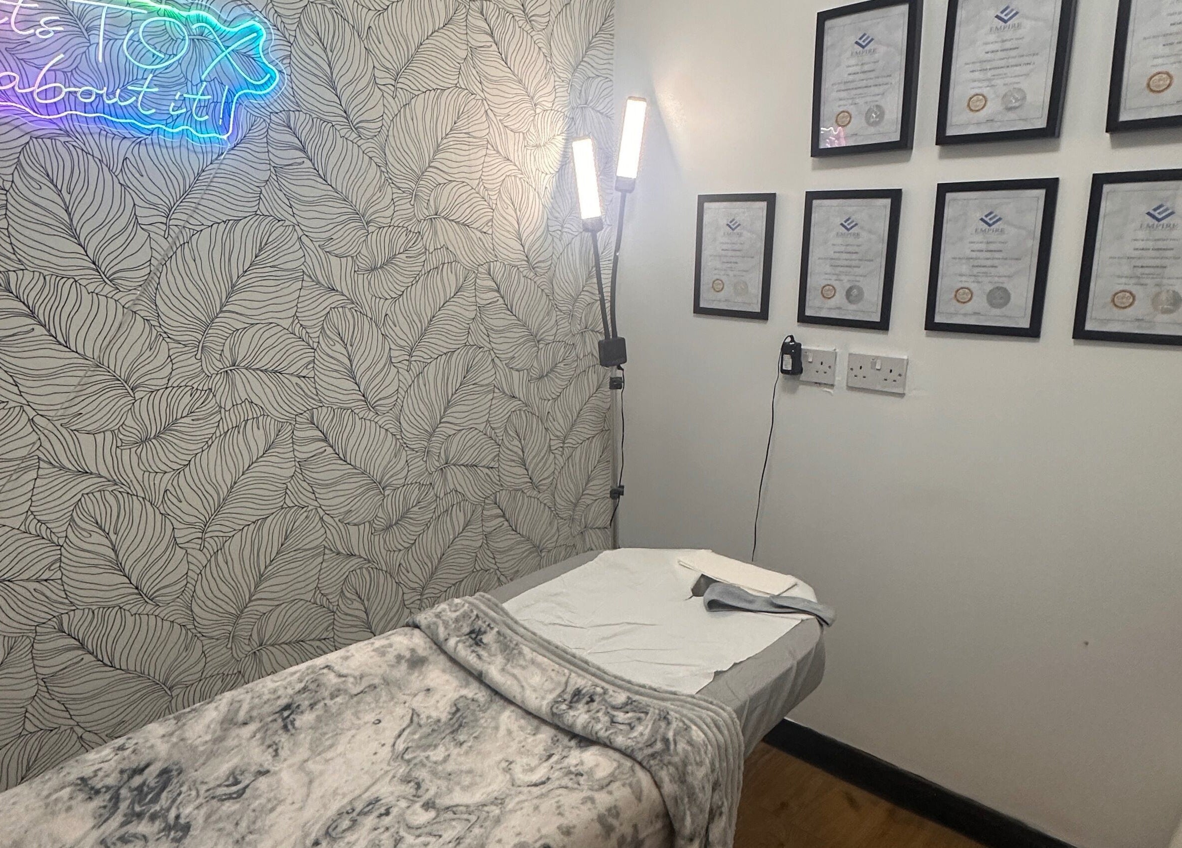 Therapy room at Beauty by Lynz in Kilsyth, Scotland, GB featuring a treatment bed and certificates.
