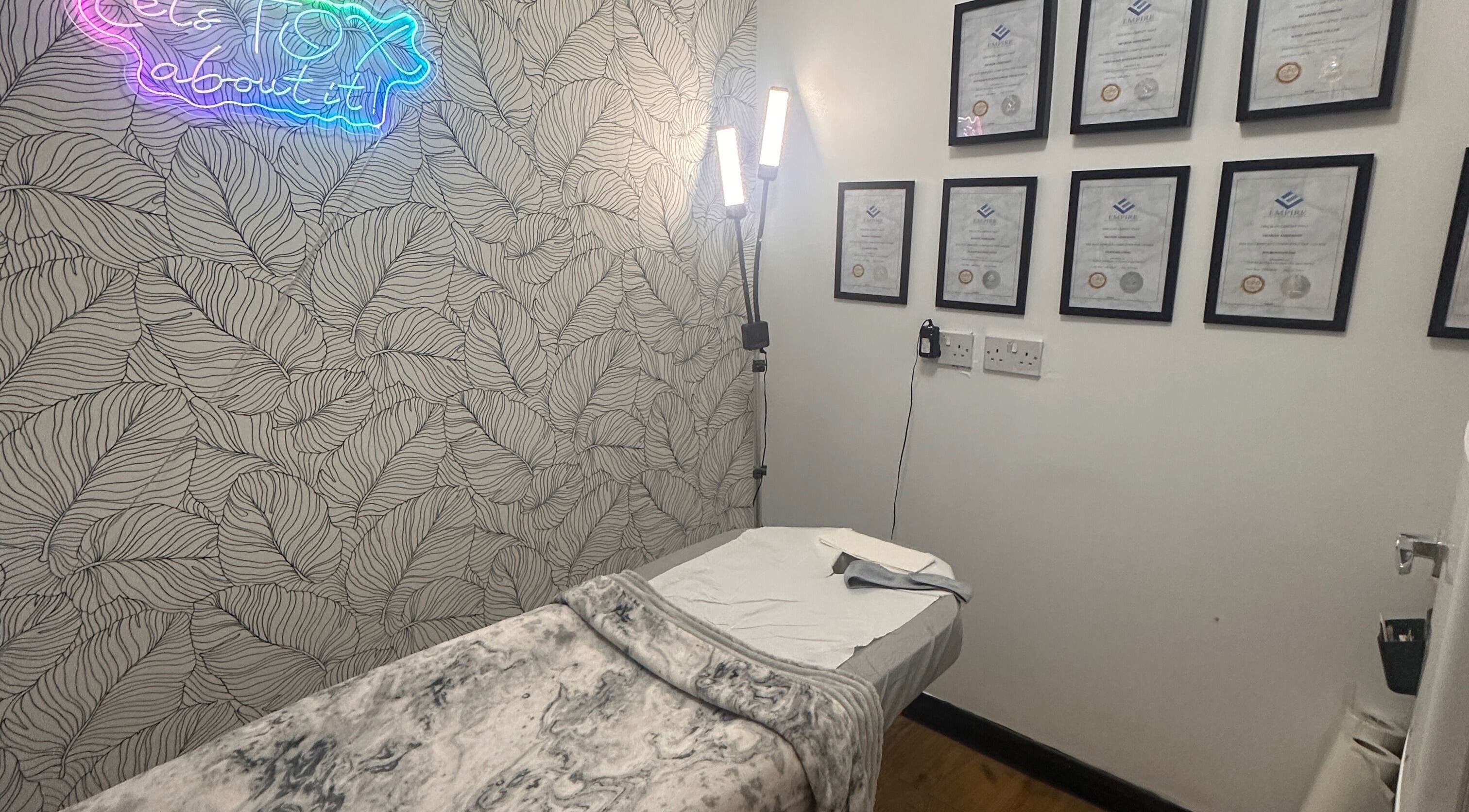Therapy room at Beauty by Lynz in Kilsyth, Scotland, GB featuring a treatment bed and certificates.