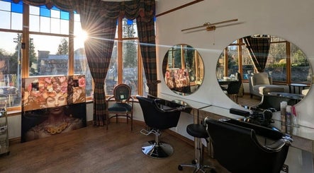 Elegant beauty station at Lovat Hair Nail and Beauty, Perth, Scotland, GB with sunlit windows and mirrors.
