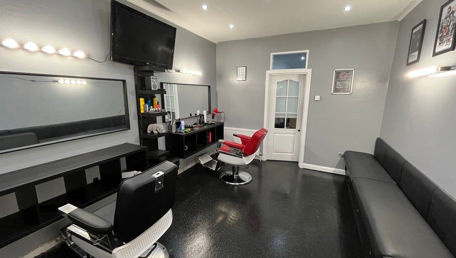 Modern barber chairs at The Barber / Barber Rhino in Carluke, Scotland, GB. Sleek, stylish interior design.