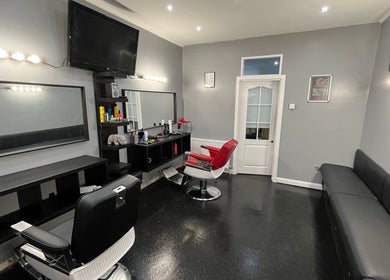 Modern barber chairs at The Barber / Barber Rhino in Carluke, Scotland, GB. Sleek, stylish interior design.