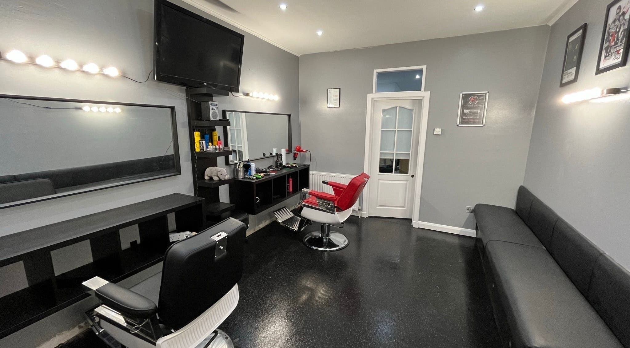 Modern barber chairs at The Barber / Barber Rhino in Carluke, Scotland, GB. Sleek, stylish interior design.