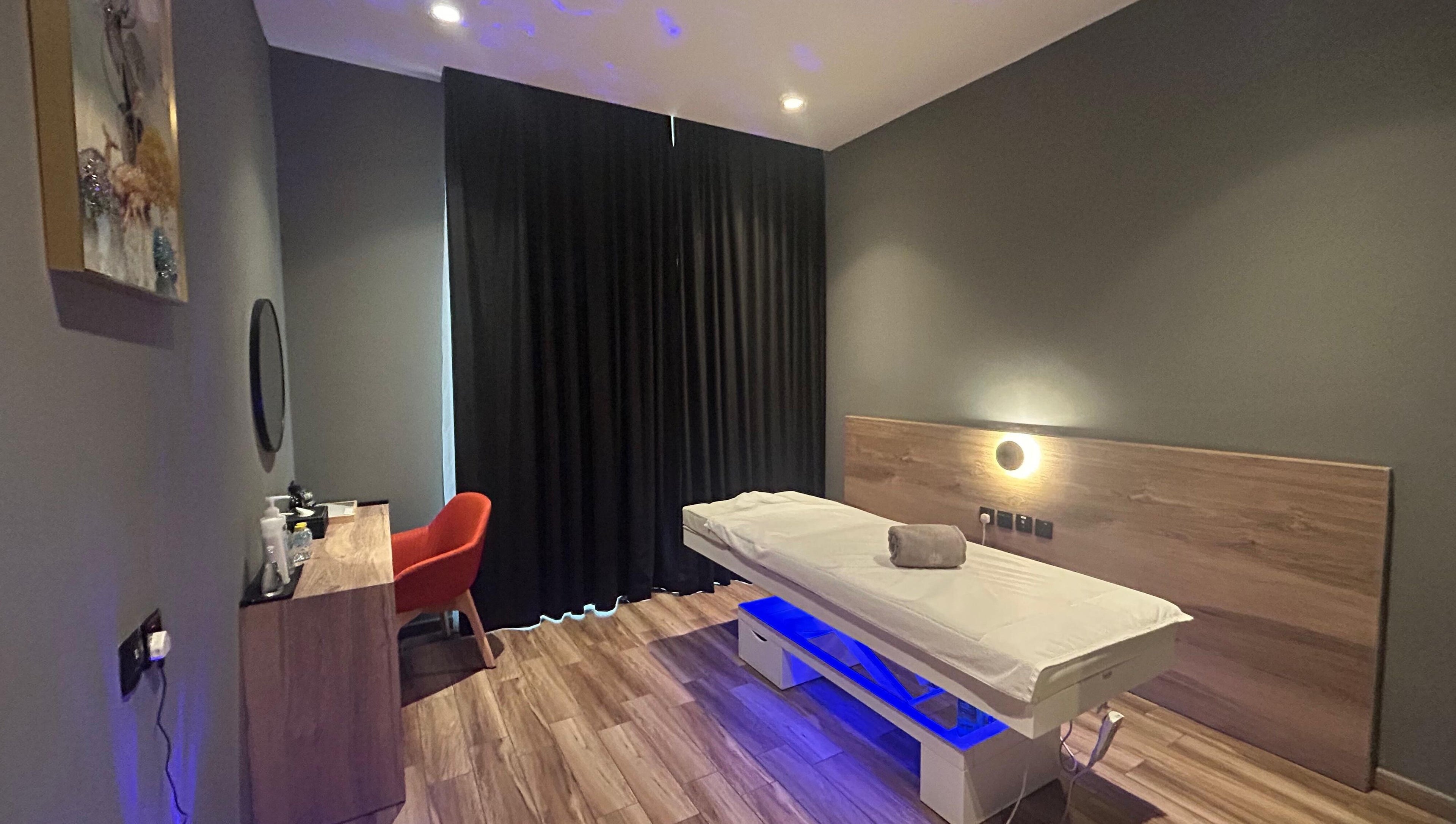 Cozy massage room at Euphoria Massage Spa, Dubai, Dubai, AE with a massage bed and ambient lighting.