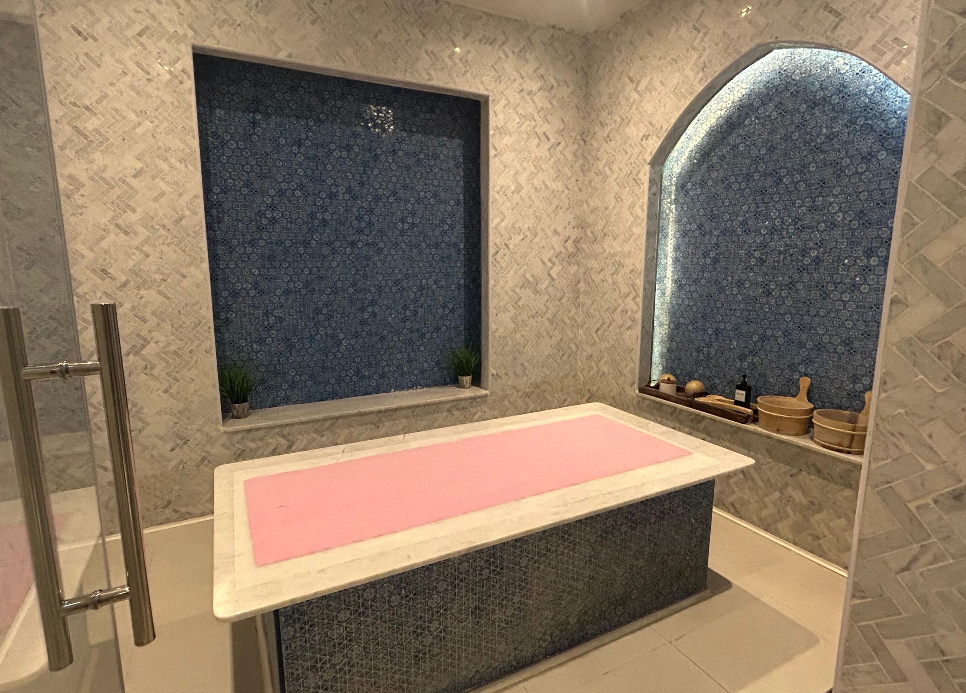 Relaxing massage room at Euphoria Massage Spa with a pink-topped table, Dubai, Dubai, AE.