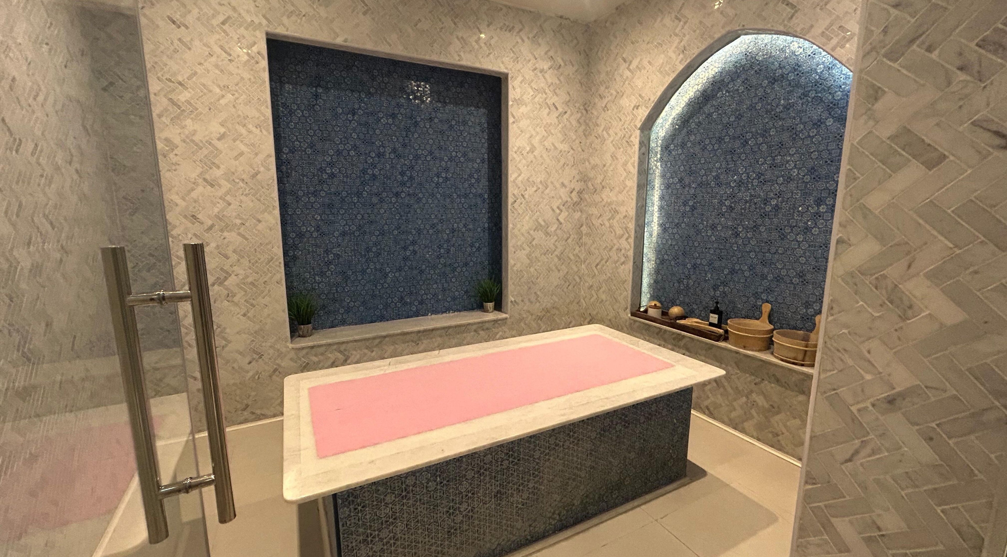 Relaxing massage room at Euphoria Massage Spa with a pink-topped table, Dubai, Dubai, AE.