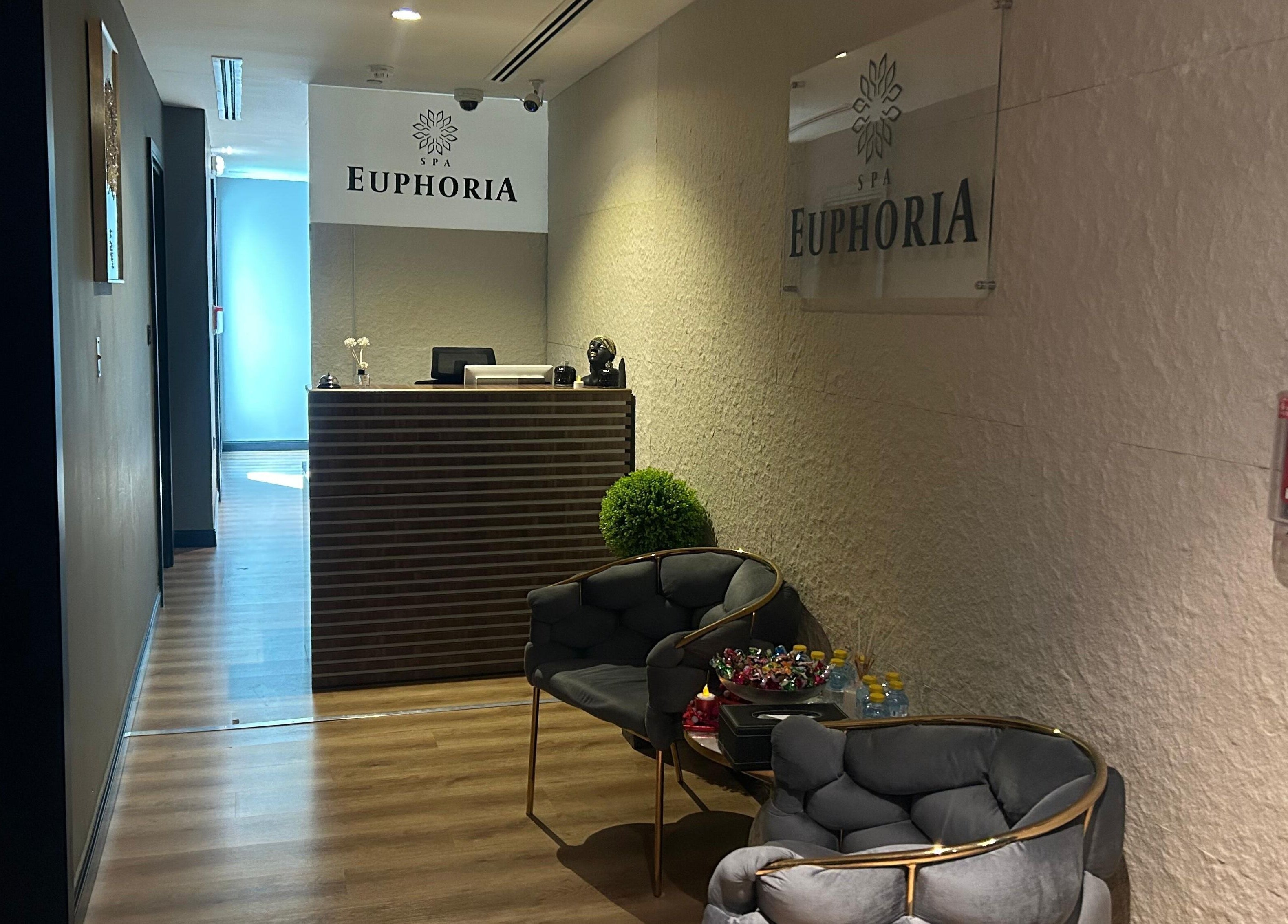 Reception area at Euphoria Massage Spa in Dubai, Dubai, AE, offering a calming ambiance with elegant seating.