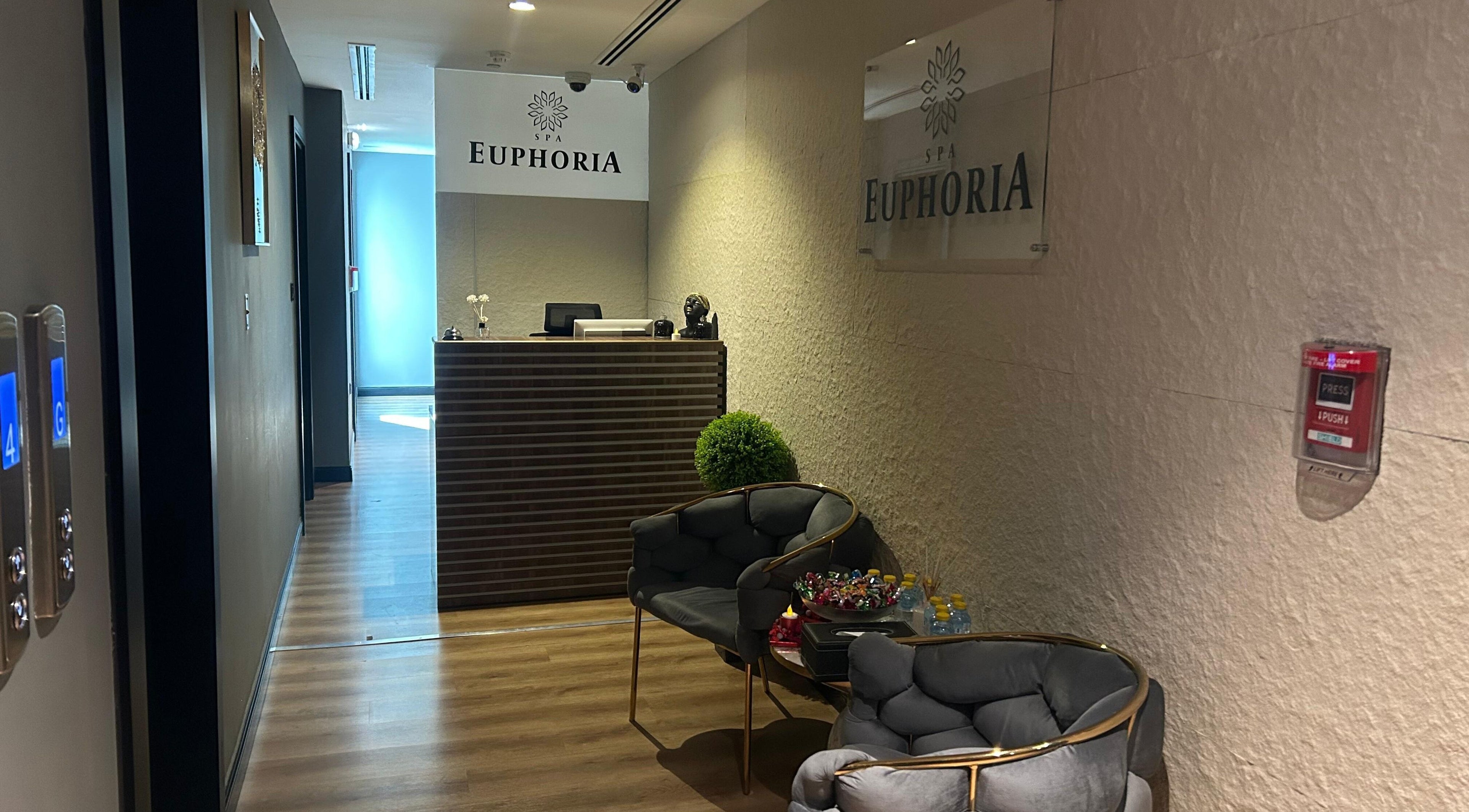 Reception area at Euphoria Massage Spa in Dubai, Dubai, AE, offering a calming ambiance with elegant seating.