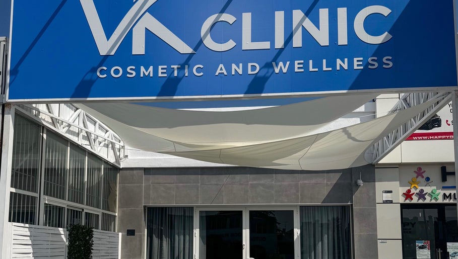 VK Cosmetic & Wellness Clinic entrance with bold signage in Alicante, Comunidad Valenciana, ES.