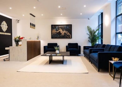 Luxurious waiting area at The Makeover Clinic in Birmingham, England, GB, featuring modern decor and comfortable seating.