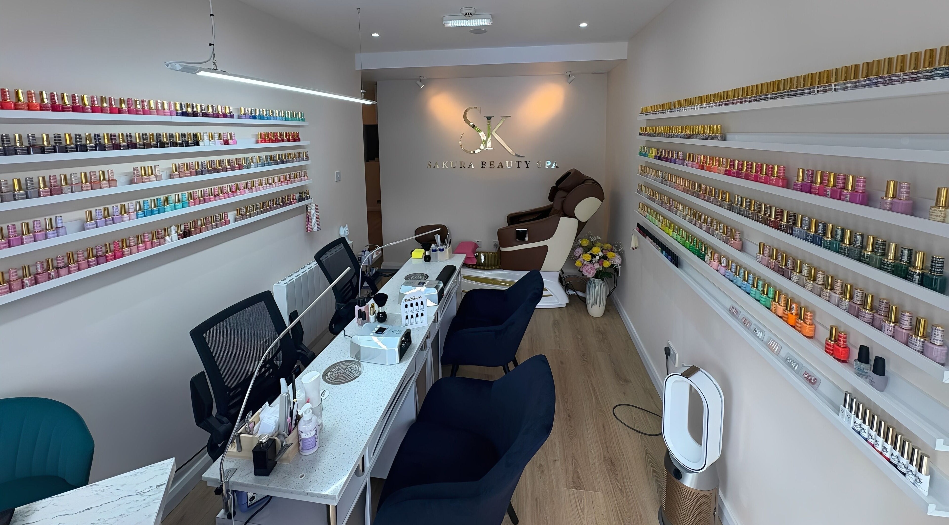Cozy nail salon at SK Beauty Spa (Goatstown), Dublin, County Dublin, IE with colorful polish display and manicure stations.