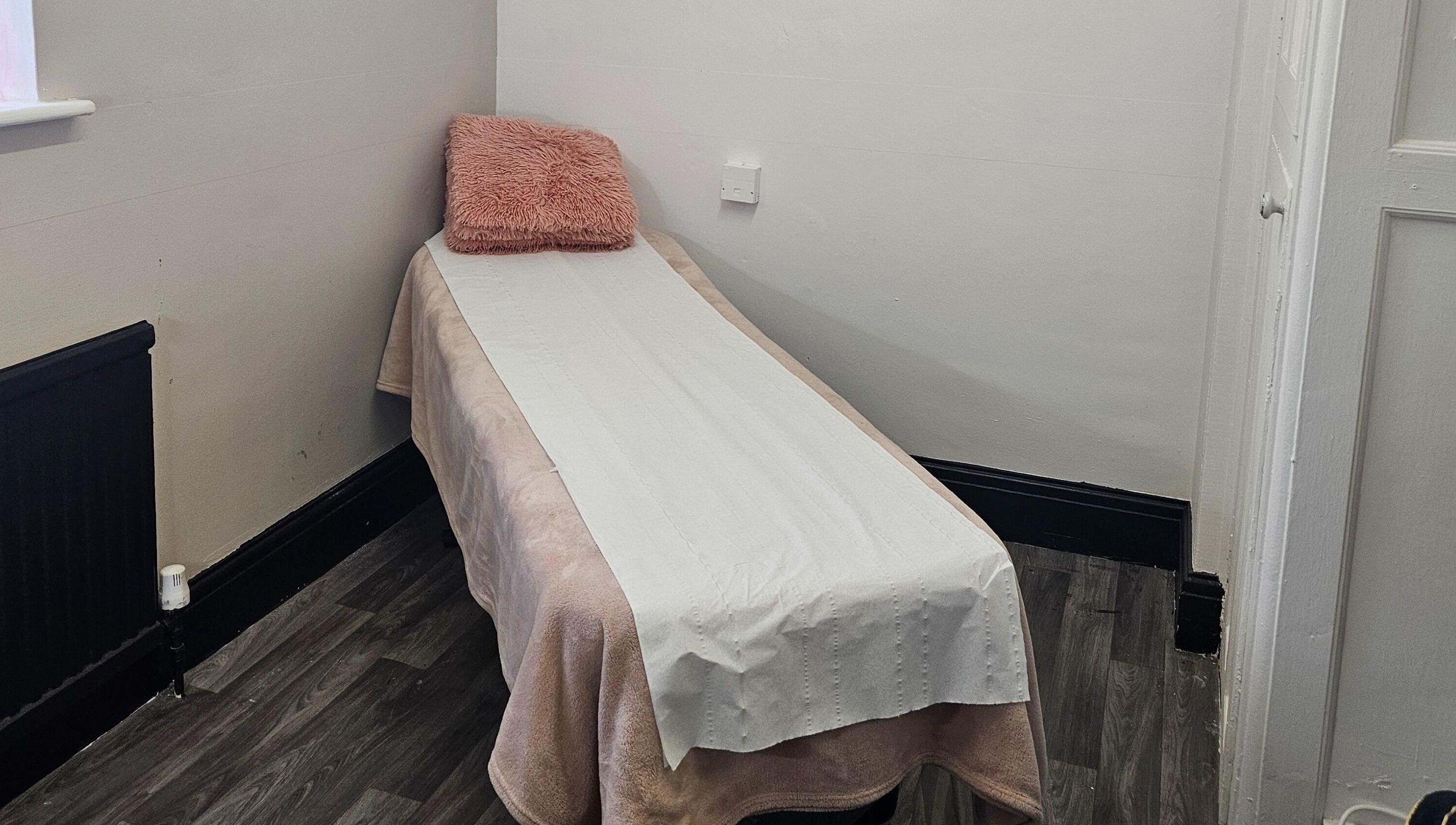 Cozy massage table at She'la's in Hasland, England, GB for relaxation and therapy.