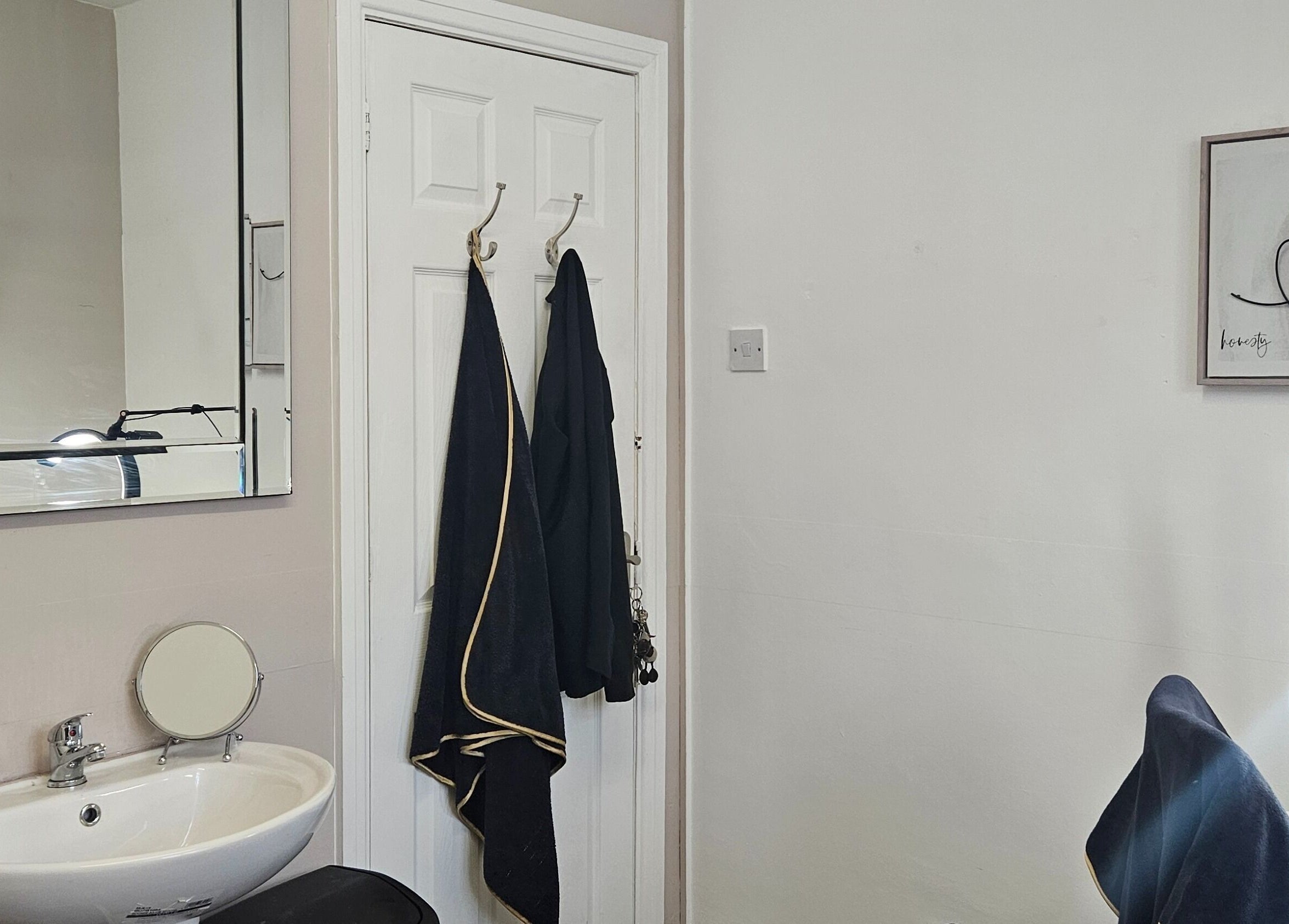 Chic beauty setup at She'la's in Hasland, England, GB, featuring a stylish sink and mirror arrangement.