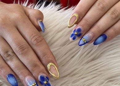 Stylish blue and gold nail art at Adore Nail & Spa, Belmore, New South Wales, AU.