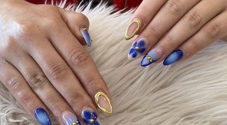 Stylish blue and gold nail art at Adore Nail & Spa, Belmore, New South Wales, AU.
