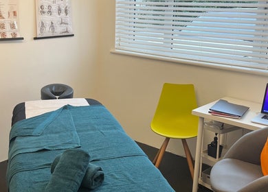 Calm therapy room in TH Performance Therapy, Cornwall Sports Massage, Padstow, England. Features massage table and decor.