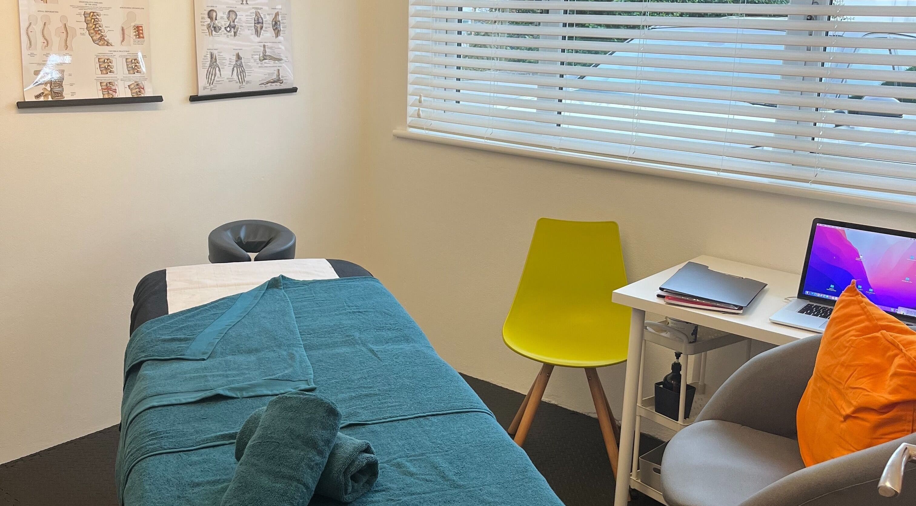 Calm therapy room in TH Performance Therapy, Cornwall Sports Massage, Padstow, England. Features massage table and decor.