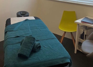Relaxing massage room at TH Performance Therapy, Cornwall Sports Massage in Padstow, England, GB with teal accents.