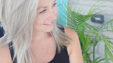 A woman with silver hair smiles at Halo Mobile Hair & Make-up, Kingston, Ontario, CA.