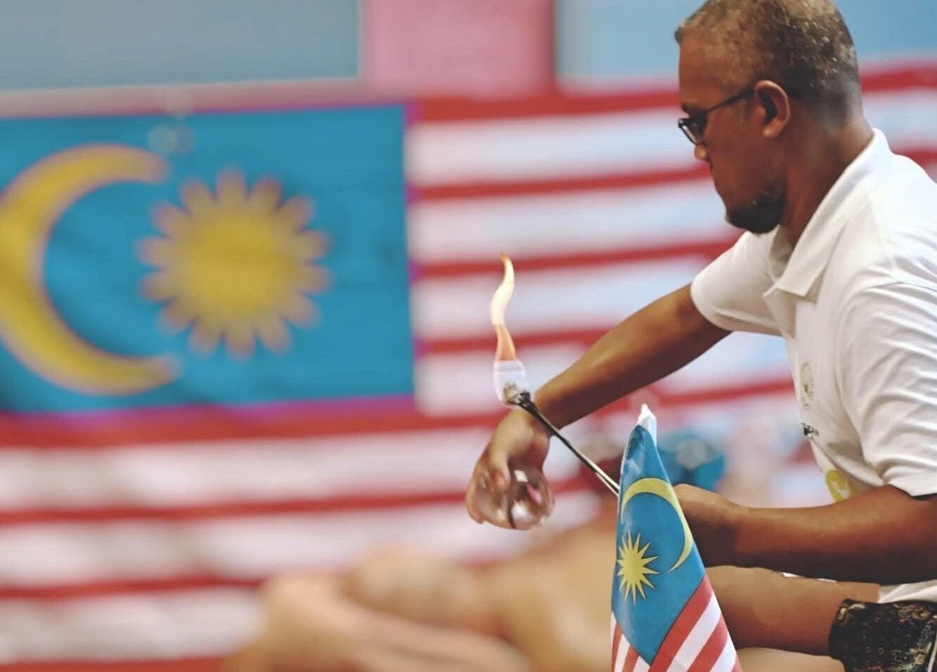 Therapist performing fire therapy at Al Raed Wellness Centre, Batu Caves, Wilayah Persekutuan Kuala Lumpur, MY.