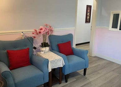 Inviting seating area with blue chairs at Swan Massage, Yuma, Arizona, US, enhancing customer relaxation.