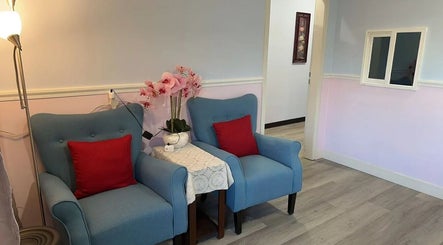 Inviting seating area with blue chairs at Swan Massage, Yuma, Arizona, US, enhancing customer relaxation.