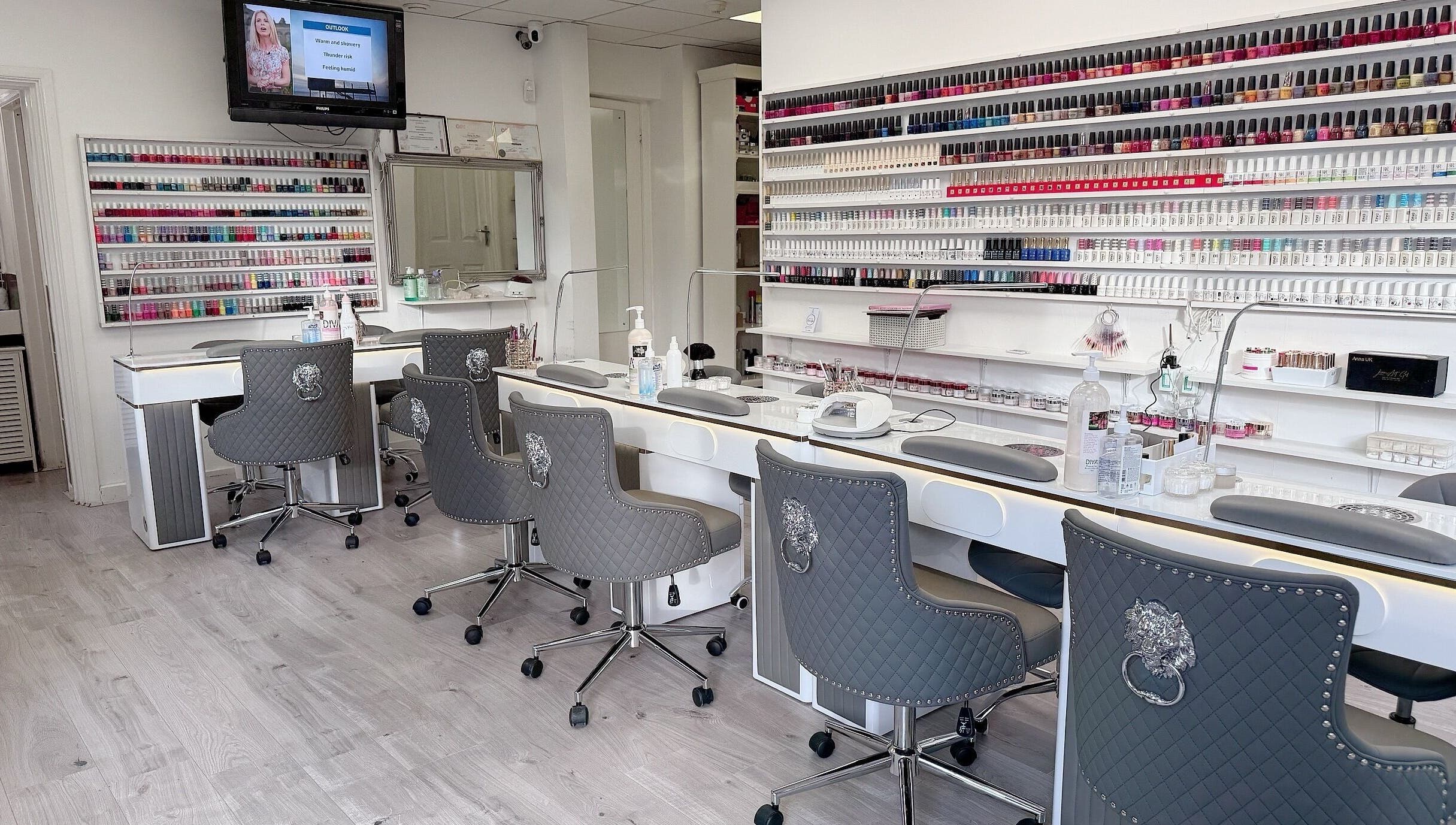 Interior of Wendy’s Nails, Kettering, England, GB, showcasing stylish workstations and an extensive polish collection.