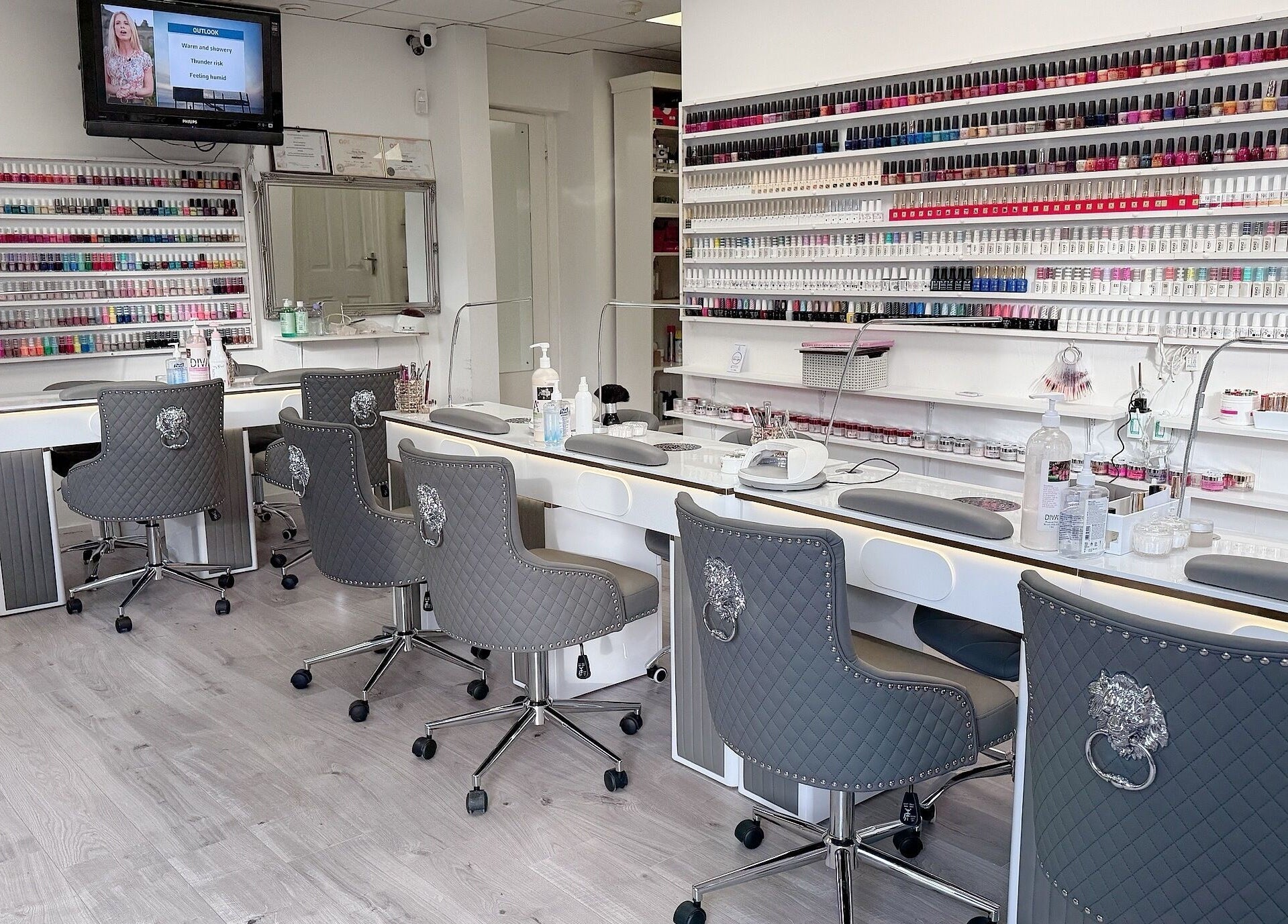 Interior of Wendy’s Nails, Kettering, England, GB, showcasing stylish workstations and an extensive polish collection.