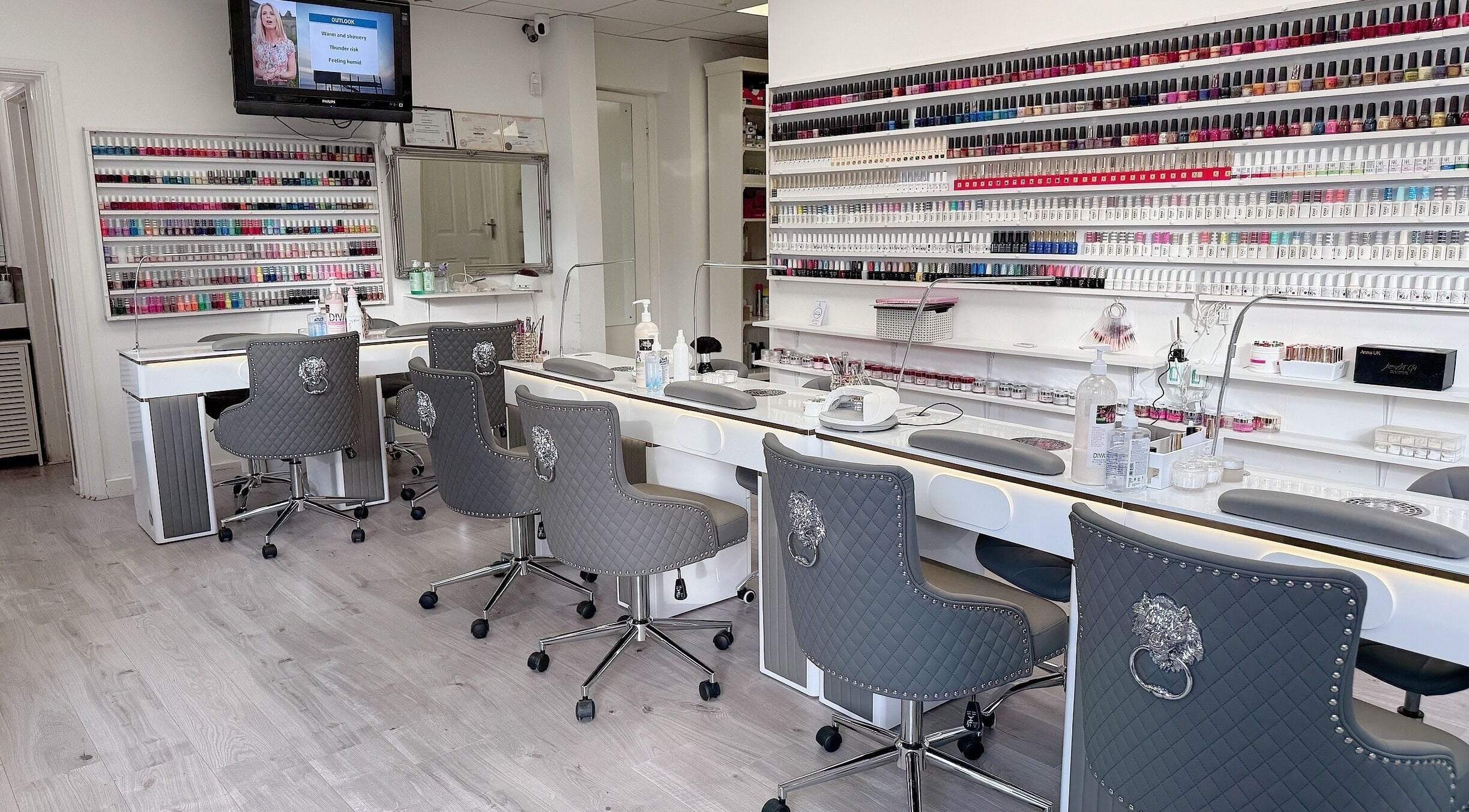 Interior of Wendy’s Nails, Kettering, England, GB, showcasing stylish workstations and an extensive polish collection.