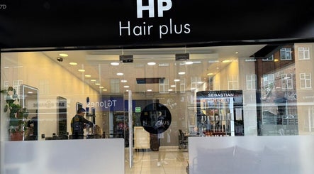 Front view of Hair Plus Southgate in London, England, GB, showcasing sleek salon interior and modern decor.
