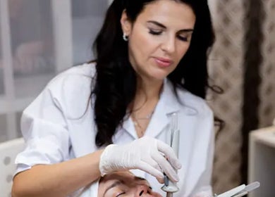Skilled aesthetician performing a facial at Luminous Lux in West Hartford, Connecticut, US.