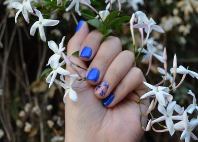 Blue manicure with floral accents at The Tipsy Pixie, Roodepoort, Gauteng, ZA.