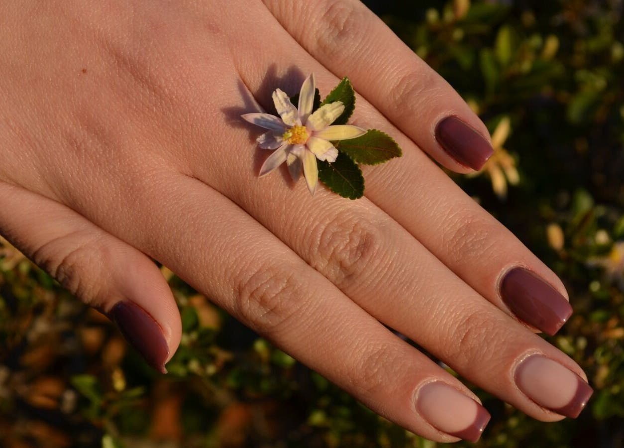 Elegant hand with floral nail art at The Tipsy Pixie, Roodepoort, Gauteng, ZA.