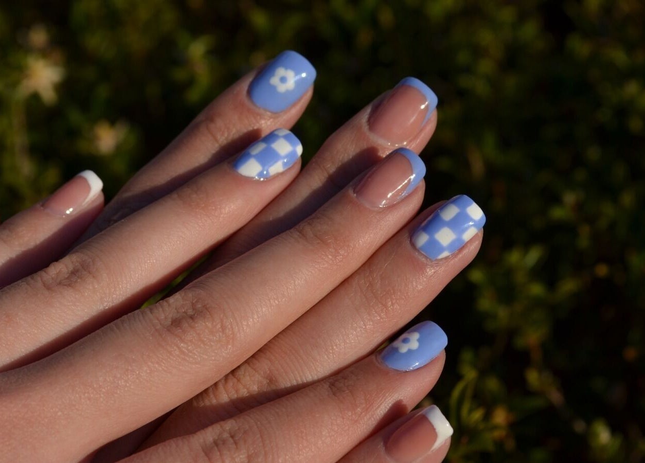 Elegant blue and white nail art at The Tipsy Pixie, Roodepoort, Gauteng, ZA showcased in natural light.