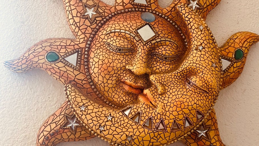 Sun and moon ceramic art at Holistic Healing Hands, Emeryville, US. A serene celestial design.