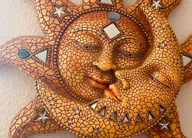 Sun and moon ceramic art at Holistic Healing Hands, Emeryville, US. A serene celestial design.