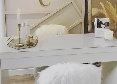 Elegant white desk with plush chair at Danni Clark Beauty, Bognor Regis, England, GB, creating a serene atmosphere.