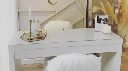 Elegant white desk with plush chair at Danni Clark Beauty, Bognor Regis, England, GB, creating a serene atmosphere.