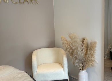 Tranquil waiting area at Danni Clark Beauty, Bognor Regis, England, GB with comfy chair and decorative vase.
