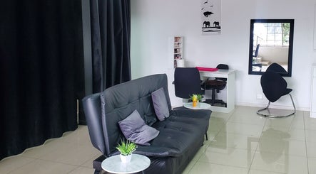 Stylish waiting area at QNails, Randburg, Gauteng, ZA with black chairs and minimal decor.