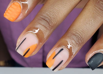 Bold nail art with orange and black at QNails, Randburg, Gauteng, ZA, showcasing trendy designs.