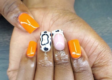Vibrant orange and artful nail design at QNails, Randburg, Gauteng, ZA.
