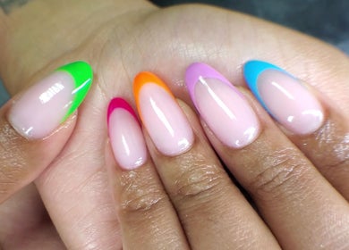 Vibrant multicolor manicure at QNails, Randburg, Gauteng, ZA, showcasing nail art excellence.