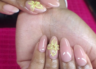 Elegant manicure with yellow floral design at NailsbyQ, Randburg, Gauteng, ZA.