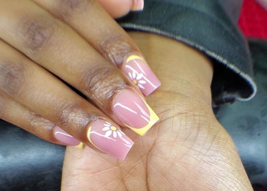 Intricate floral nail art at NailsbyQ, Randburg, Gauteng, ZA. Dainty white flowers on a pink base.