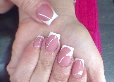 Elegant French manicure at NailsbyQ, Randburg, Gauteng, ZA showcases polished and stylish nails.