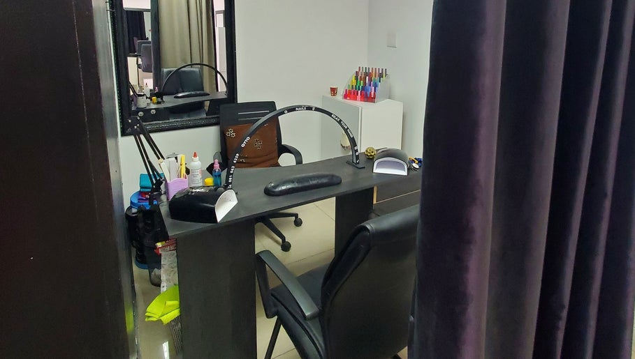 Nail station interior at NailsbyQ, Randburg, Gauteng, ZA featuring comfortable seating and nail tools.