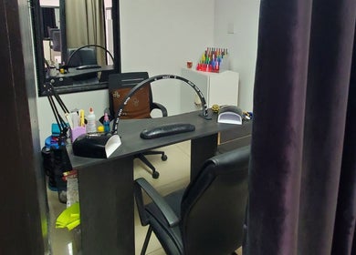 Nail station interior at NailsbyQ, Randburg, Gauteng, ZA featuring comfortable seating and nail tools.