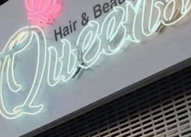 Neon sign for HairbyBryanMurphy in Glasgow, Scotland, GB, glowing with vibrant colors.