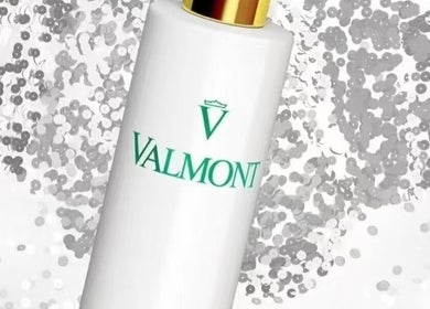 Valmont bottle against elegant glitter, featured at Lumi Skin & Body, Calgary, Alberta, CA.
